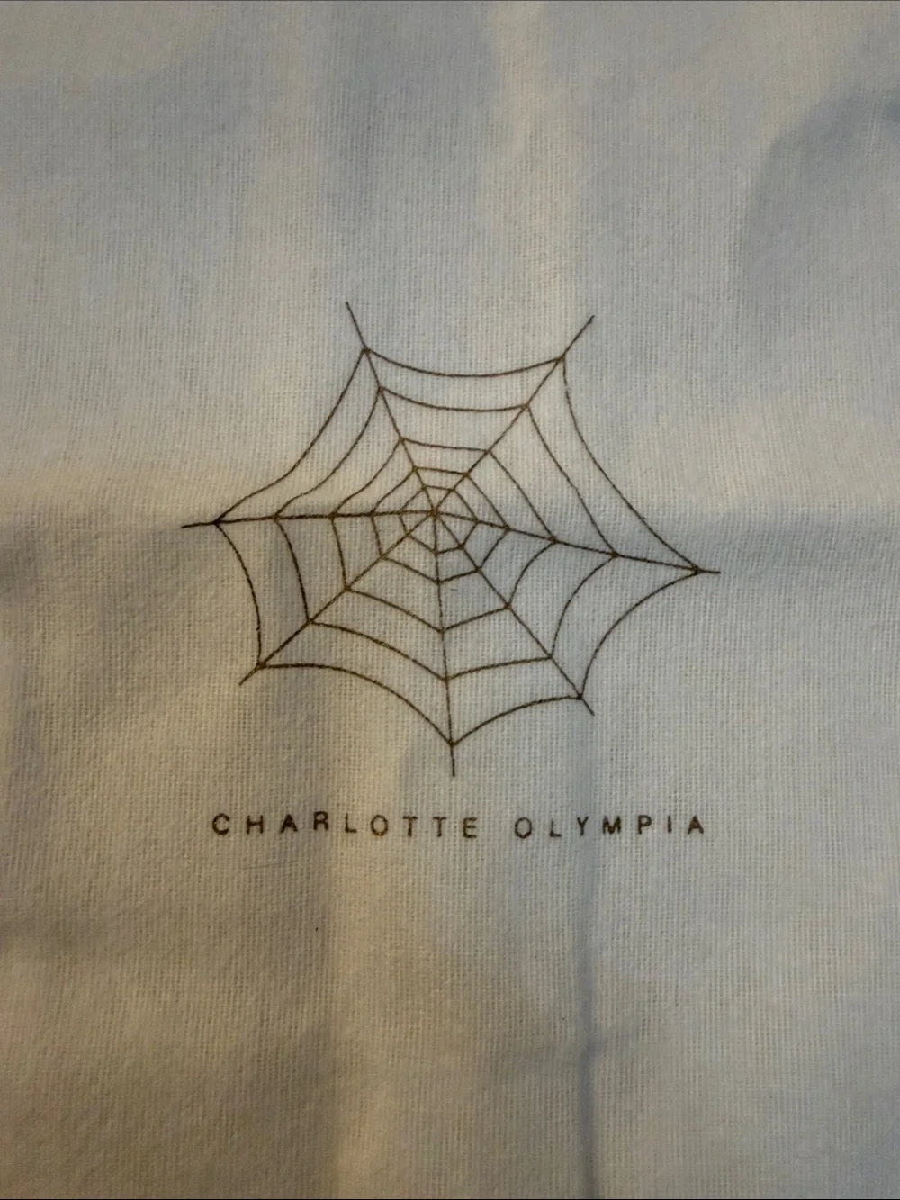 Charlotte Olympia Cream Drawstring Bag with Spiderweb Print